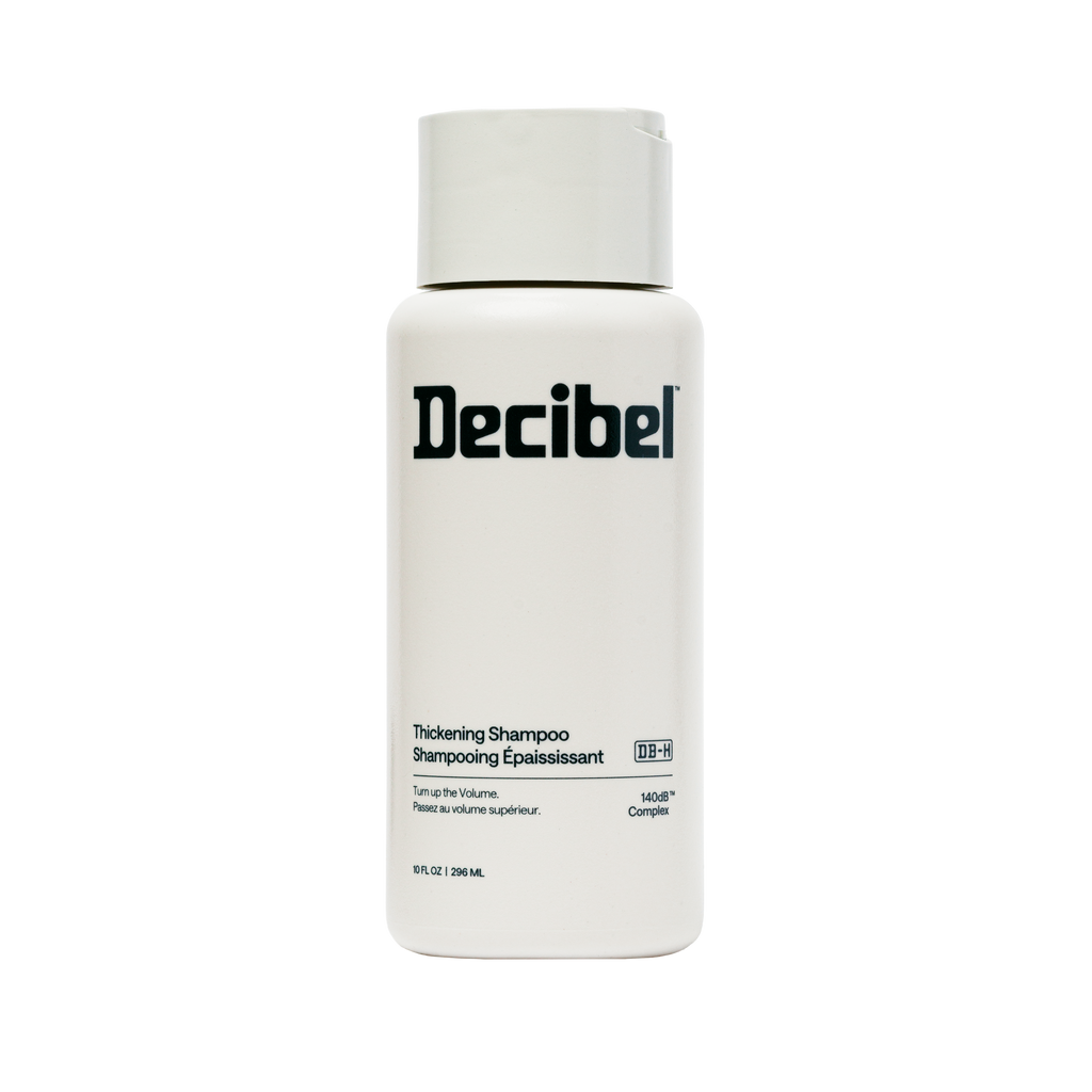 Thickening Shampoo van Decibel, witte flacon met zwart logo
