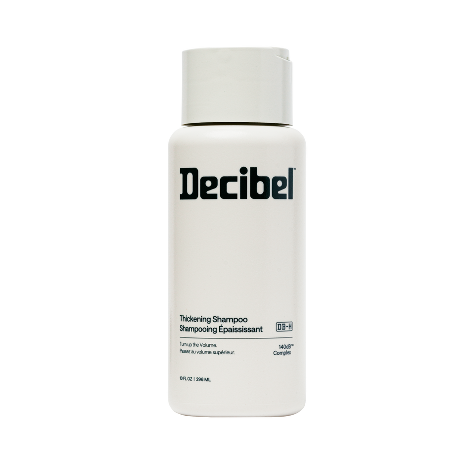 Thickening Shampoo van Decibel, witte flacon met zwart logo